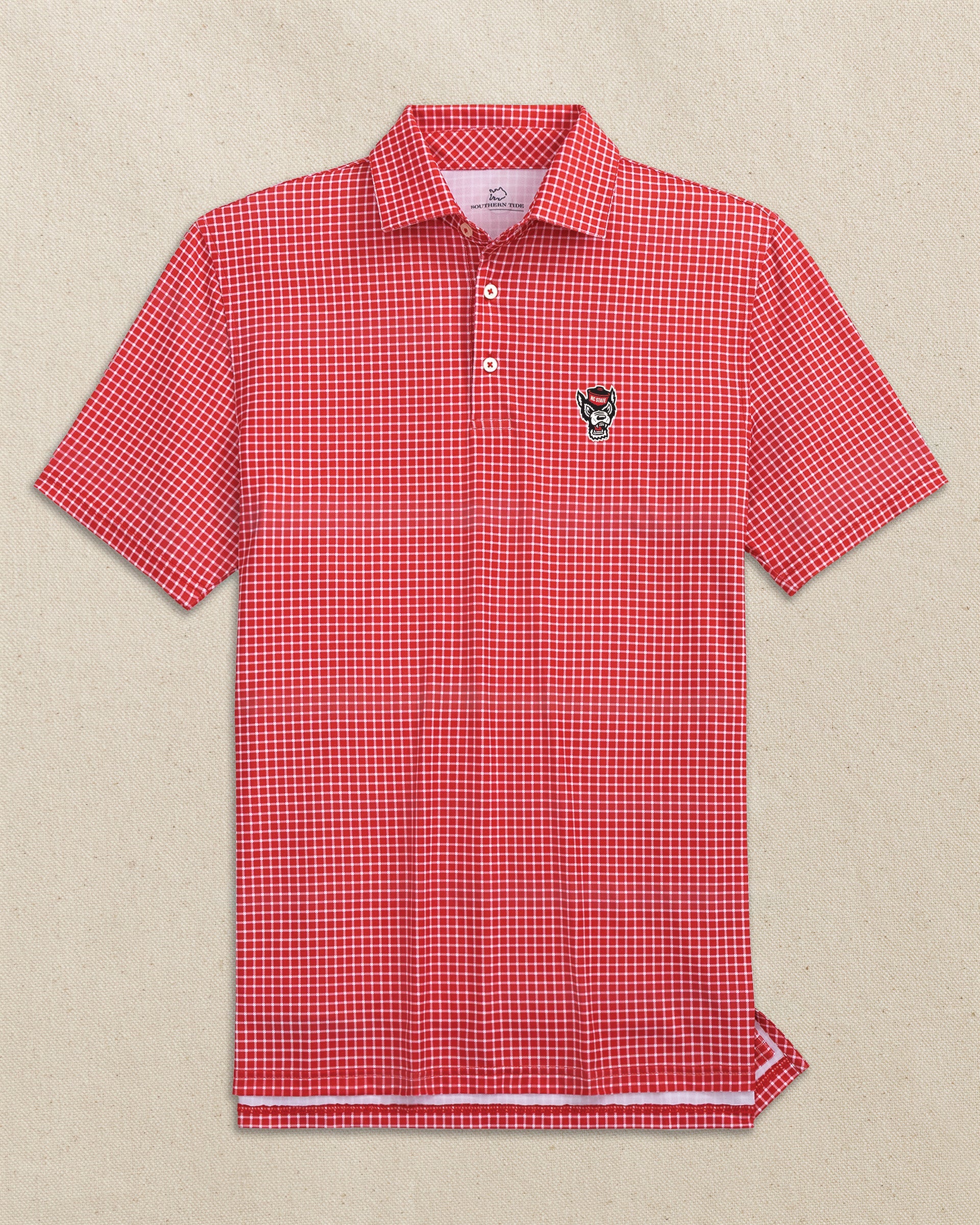 The front view of the Southern Tide NC State Wolf Head Driver Dunes Edge Plaid Polo by Southern Tide - Varsity Red