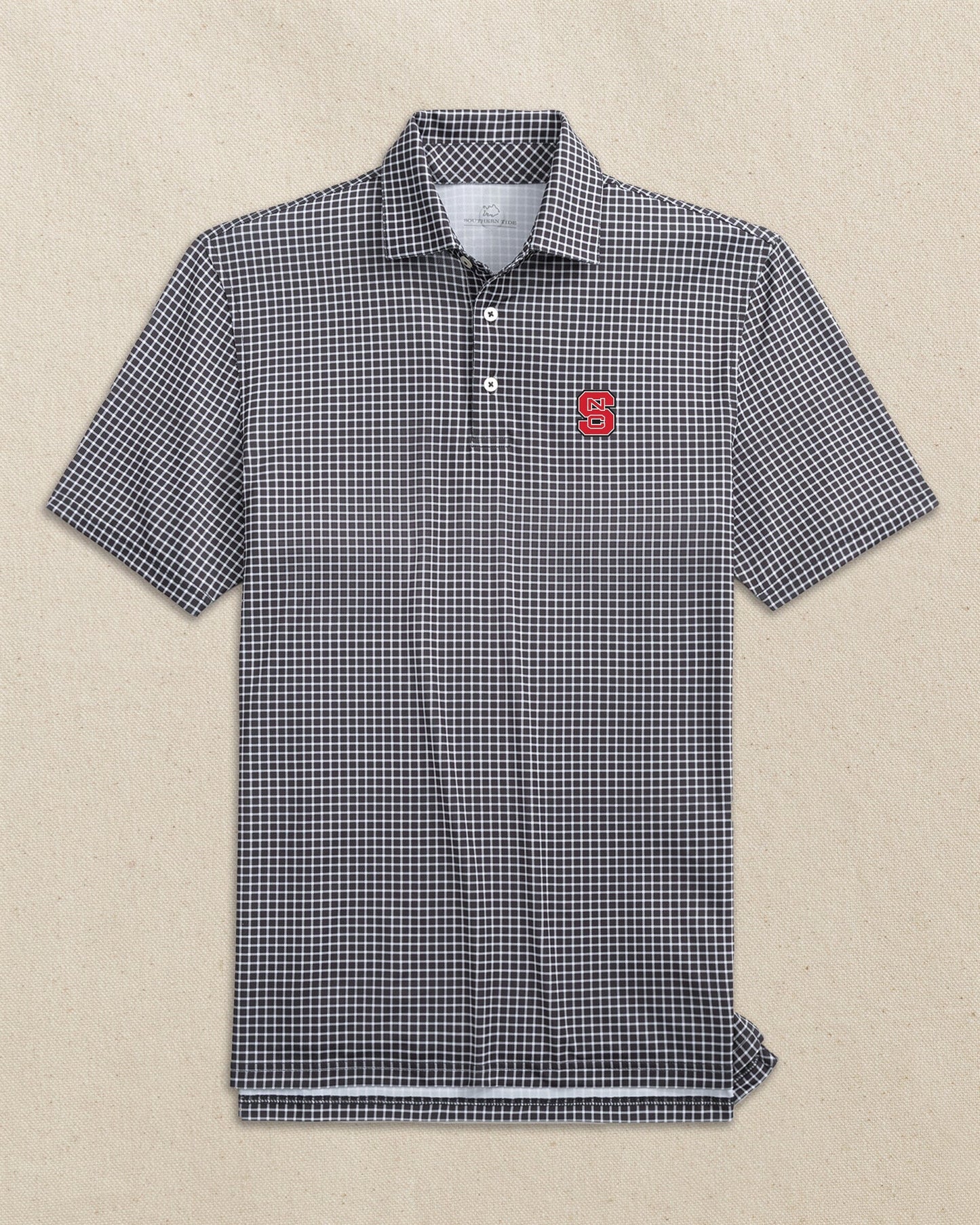 The front view of the Southern Tide NC State Wolfpack Driver Dunes Edge Plaid Polo by Southern Tide - Black
