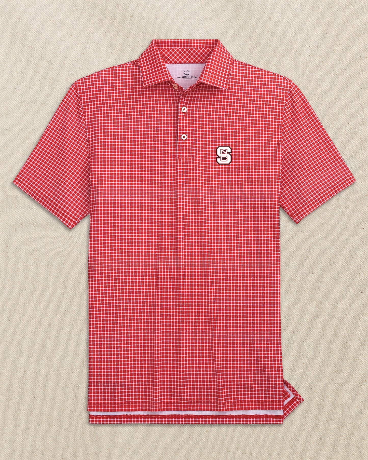 The front view of the Southern Tide NC State Wolfpack Driver Dunes Edge Plaid Polo by Southern Tide - Varsity Red