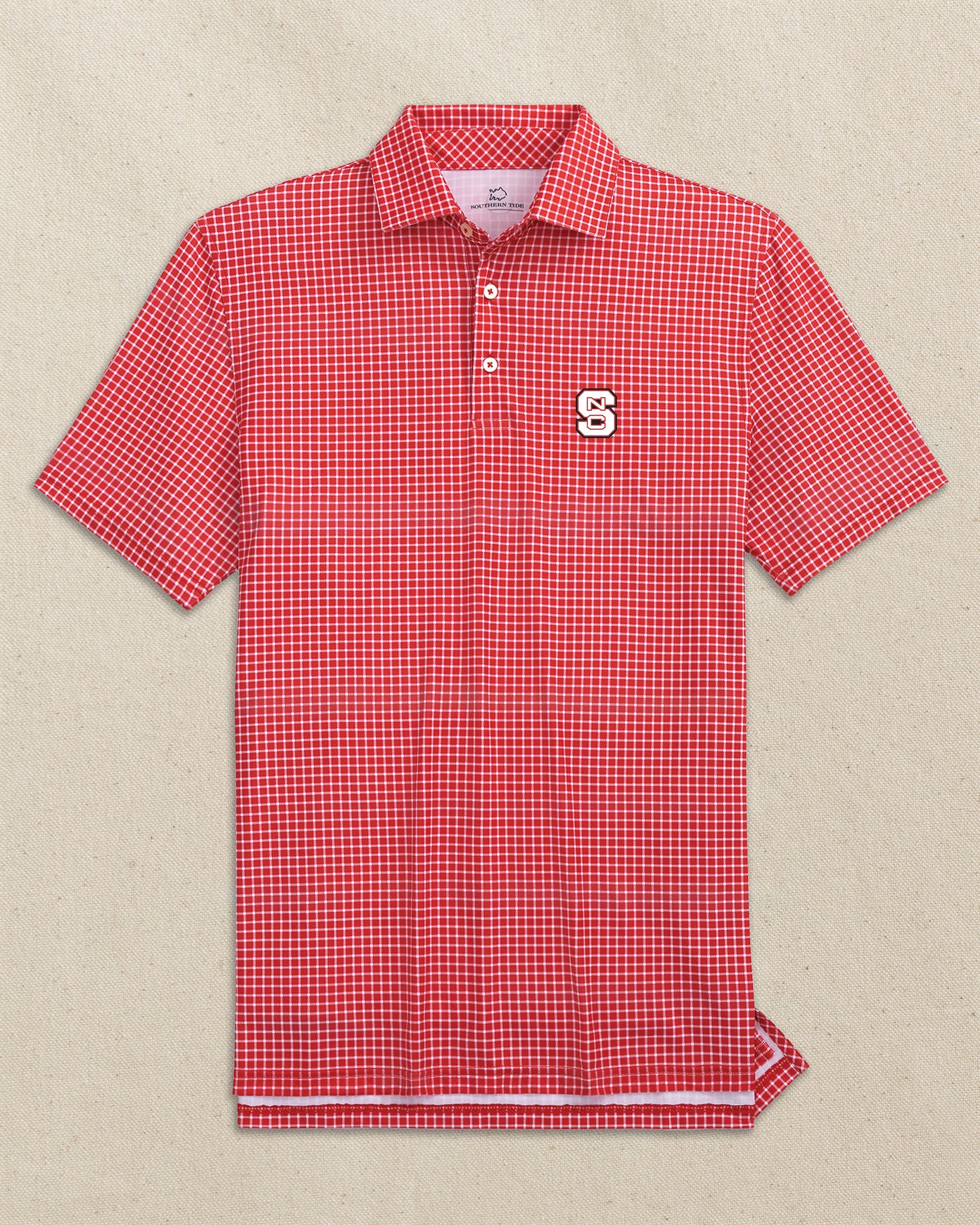 The front view of the Southern Tide NC State Wolfpack Driver Dunes Edge Plaid Polo by Southern Tide - Varsity Red